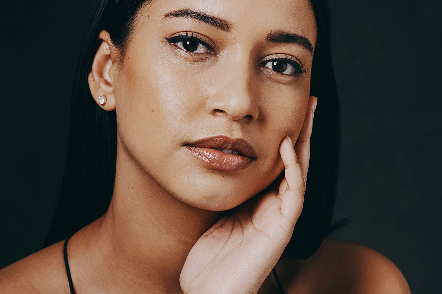 Close-up of a woman with a thoughtful expression.