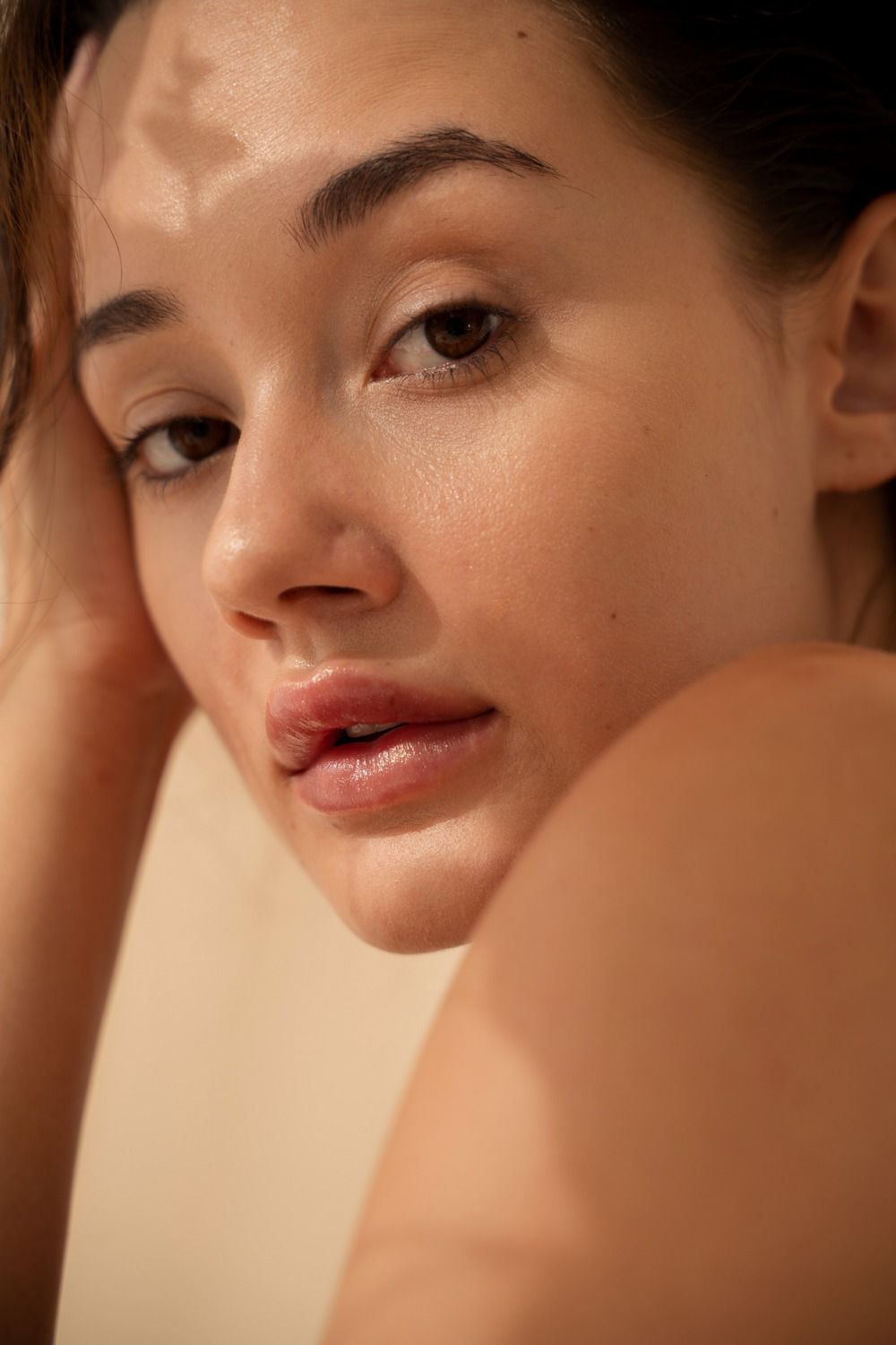 Close-up of a woman's face, natural lighting.