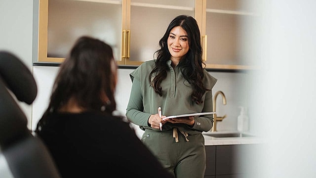 Consultation between two women in a modern setting.