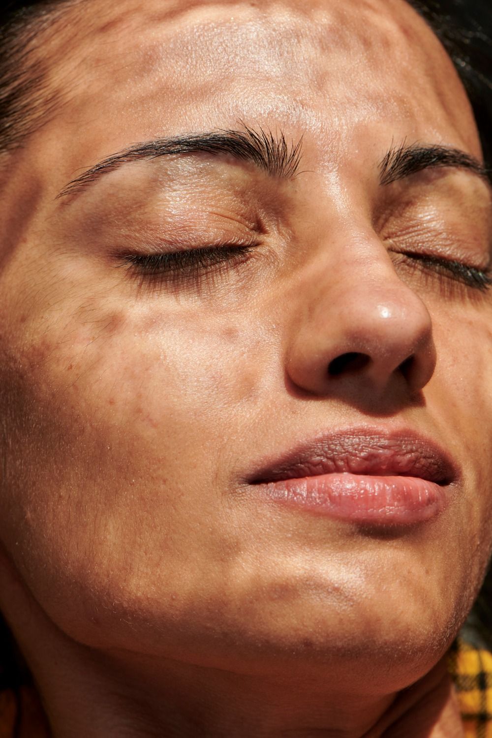 Close-up of a serene woman's face.